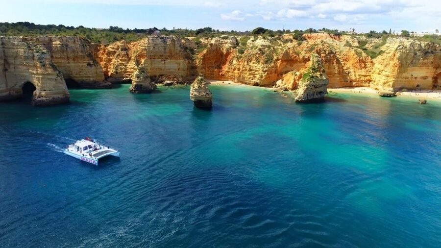 Albufeira: Catamaran Cruise with BBQ & Open Bar on the Beach - Open bar, swimming, and the dinghy transfer