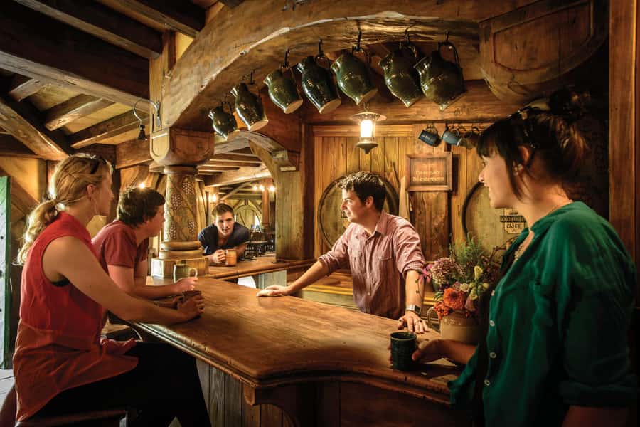 From Auckland: Hobbiton Movie Set Trip with Guided Tour - Walking through the 12-acre movie set