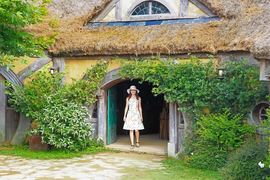 From Auckland: Hobbiton & Rotorua Tour with Lunch at Te Puia - Entering Hobbiton near Matamata