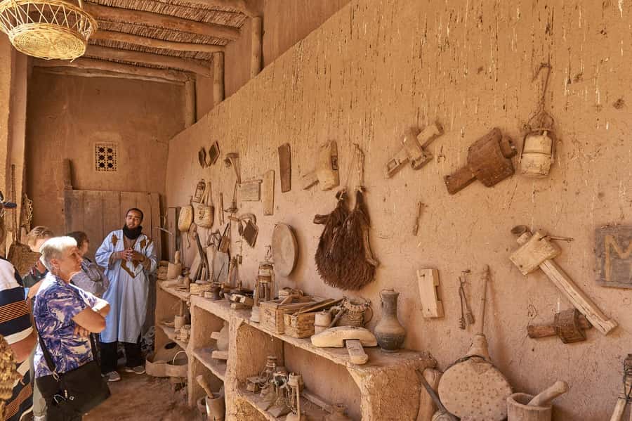 From Ouarzazate: Aït Benhaddu, Fint Oasis & Film Studio Trip - Walking through Aït Ben Haddou