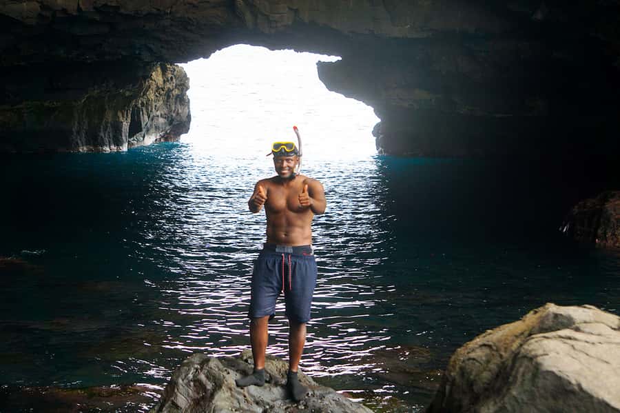 From Praia: Boat Trip, Snorkeling, Cave & BBQ on the Beach - A black-sand beach with a very simple lunch