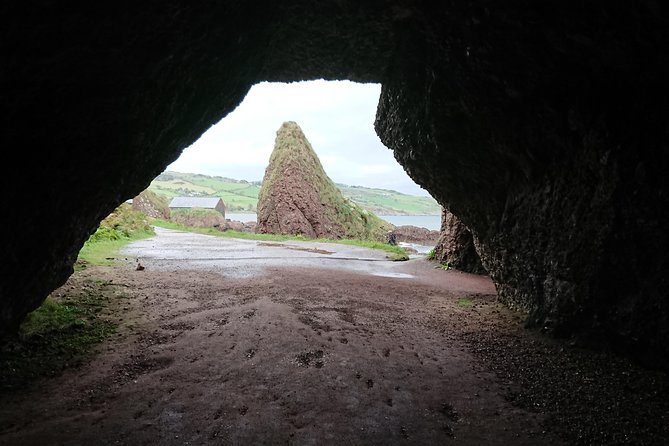 Private Game of Thrones Filming Locations Tour From Belfast - Dunluce Castle above the sea