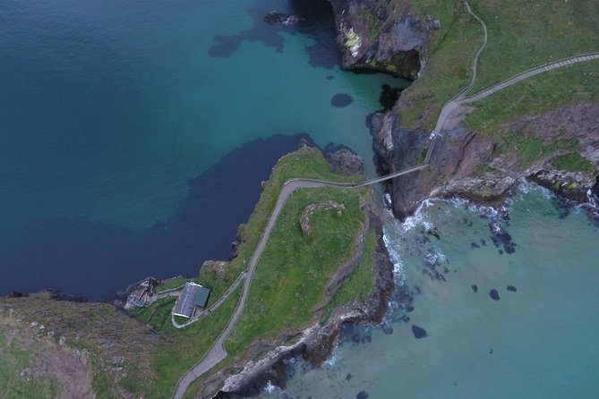 Private Tour: Giant's Causeway, Norman Castles, and Game of Thrones Film Locations - Dunluce Castle, a dramatic ruin above the sea