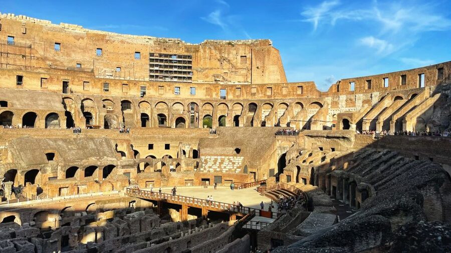 Rome: Colosseum, Gladiator Arena & Roman Forum Private Tour - Entering the Colosseum through the express security line