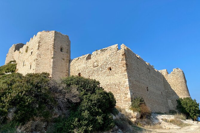 Small group hiking between the beach and Kritinia Castle - A village coffee after the trail